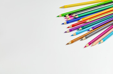 Colored pencils for drawing various colors on a white background.