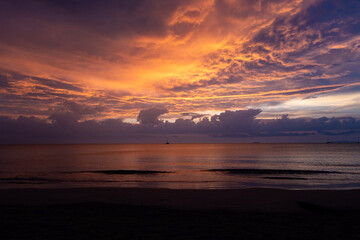 Fototapeta na wymiar Orange sunset on the beach of Thailand