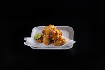 Chicken Karaage Japanese Fried chicken isolated in black background