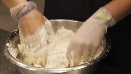 Following Close Up Shot of Woman in Rubber Gloves Kneading Dough