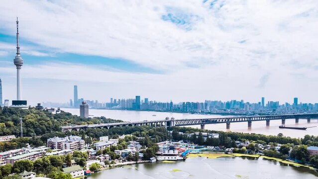 Timelapse photography of cityscape of Guishan TV Tower and Wuhan Yangtze River Bridge in Wuhan, Hubei, China