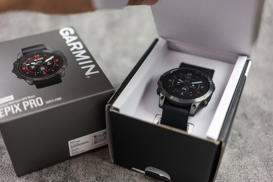 Bangkok, Thailand - January 24, 2024 : Open box of Garmin Epix Pro Gen 2, Sapphire Edition 47 mm. The black watch is suitable for men in every occasion. Unpacking purchase concept