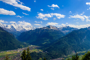Naklejka na ściany i meble Breathtaking aerial view of Interlaken and Swiss Alps from Harder Kulm viewpoint, Switzerland