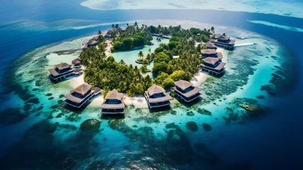 Fototapeten Pool in the tropical island. Aerial view of luxury resort bungalows along the coastline of a small island, Indian Ocean, Maldives  © Oleksandra