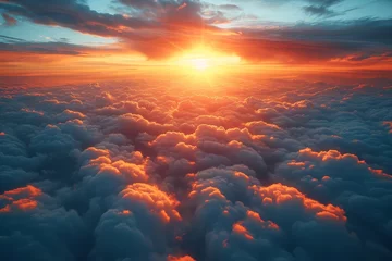 Fotobehang The vibrant hues of the afterglow illuminate the sky, casting a warm embrace over the tranquil clouds as the sun sets behind the distant horizon, while a plane glides through the serene nature © Sandra