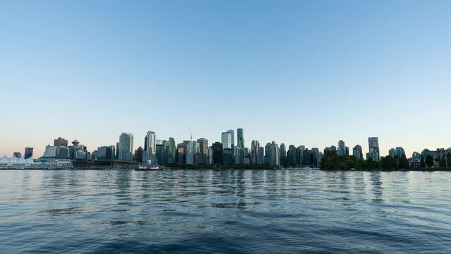 A 4k sunset time-lapse of the Vancouver skyline and Vancouver Harbour from Stanley Park.