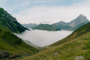Fototapeta na wymiar Low clouds in a valley in the French Pyrenees in France