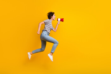Fototapeta na wymiar Full length profile photo of energetic nice person jump rush communicate loudspeaker empty space isolated on yellow color background