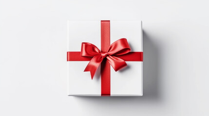 White gift box with red ribbon bow on white background