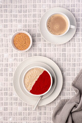 Food photography of oatmeal, porridge, raspberry, jam, fibre, coffee, cappuccino, flaxseed, vegan, wholegrain, brunch, breakfast