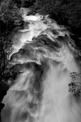 waterfall in the mountains black and white