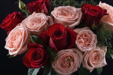 Obraz premium A Detailed photo beautiful flowers bouquet red roses herbal in dark background