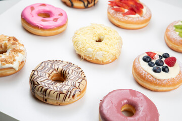 Naklejka na ściany i meble fruity and delicious doughnut isolated on white background