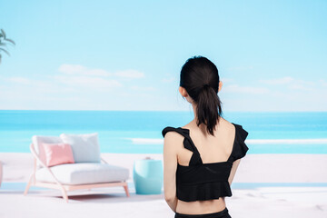 Fototapeta na wymiar 水着を着て海を眺める若い女性