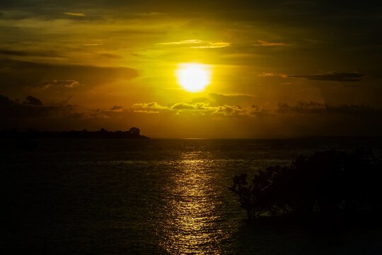 a picture of the sun setting in on the indian ocean island of wasini in kwale county kenya