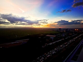 a sunset in the busy nairobi city