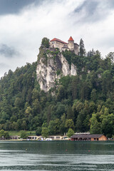 Lake Bled Slovenia. Beautiful mountain lake with small Pilgrimage Church. Most famous Slovenian lake and island Bled with Pilgrimage Church of the Assumption of Maria and Bled Castle in background.
