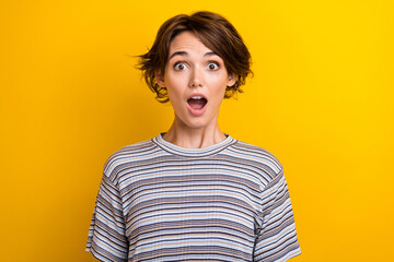Photo of astonished crazy funny woman with bob hairdo dressed striped t-shirt staring open mouth...