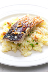 grilled carp with garlic served with mashed potatoes