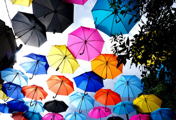 Colorful umbrellas covering the sky