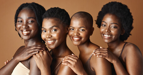 Face, beauty and smile with black woman friends in studio on a brown background for natural...