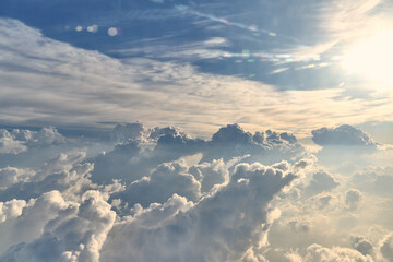 Clouds in the morning at high altitude that move and pass in the sky, illuminated by the sun's rays