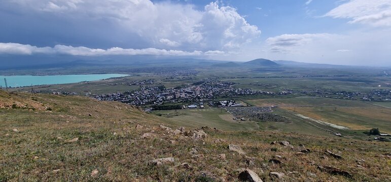 Armenia landscape, village, mountains, lake Sevan, summer scenery oncoming storm