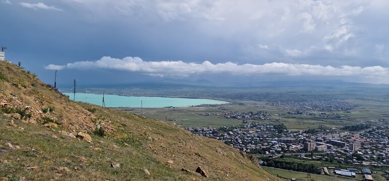 Armenia landscape, village, mountains, lake Sevan, summer scenery oncoming storm