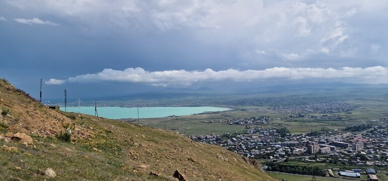 Armenia landscape, village, mountains, lake Sevan, summer scenery oncoming storm