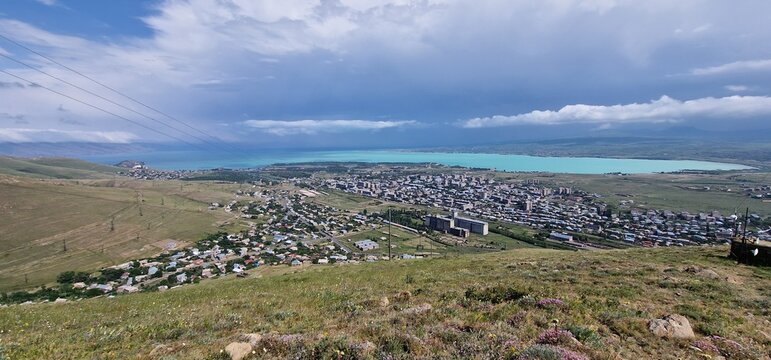 Armenia landscape, village, mountains, lake Sevan, summer scenery oncoming storm