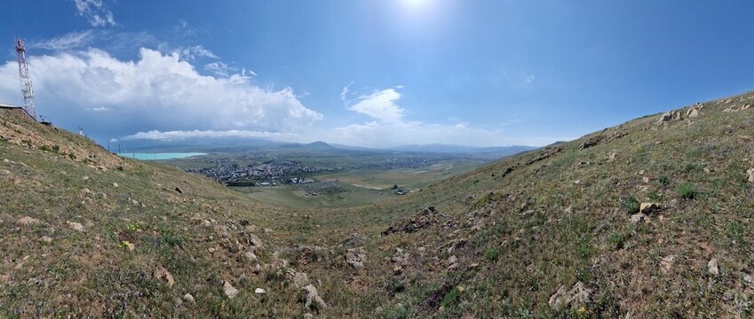 Armenia landscape, village, mountains, lake Sevan, summer scenery oncoming storm