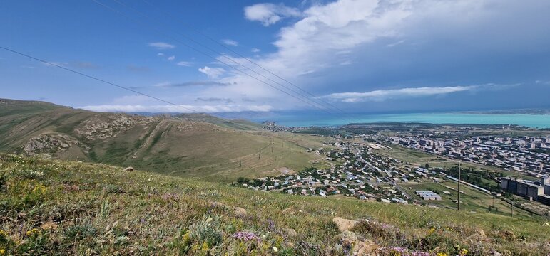 Armenia landscape, village, mountains, lake Sevan, summer scenery oncoming storm