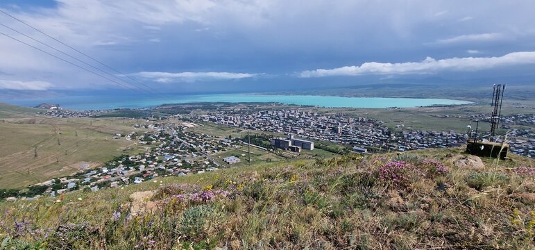 Armenia landscape, village, mountains, lake Sevan, summer scenery oncoming storm