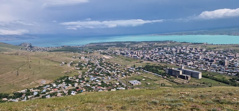 Armenia landscape, village, mountains, lake Sevan, summer scenery oncoming storm