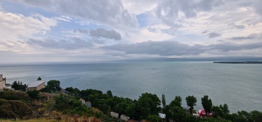 lake sevan in armenia and clouds falling over the mountains