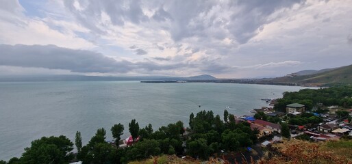 lake sevan in armenia and clouds falling over the mountains