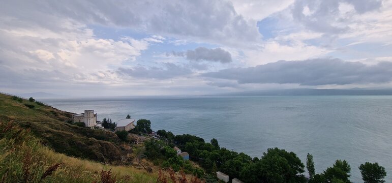 lake sevan in armenia and clouds falling over the mountains