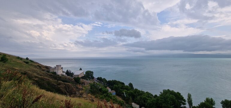lake sevan in armenia and clouds falling over the mountains