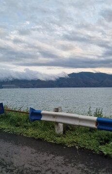 lake sevan in armenia and clouds falling over the mountains
