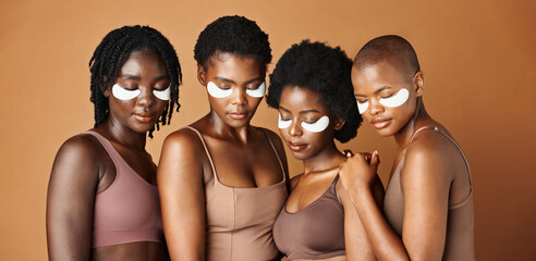 Happy black woman, eye patches and skincare for beauty, epilation or anti aging against a brown...