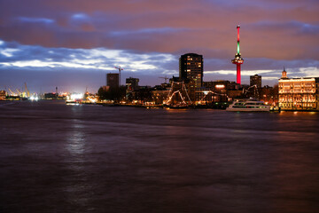 Rotterdam, Netherlands - December 26, 2023: Rotterdam skyline cityscape illuminated at night. View...