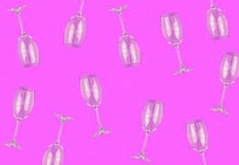 Empty wineglasses on the pink background. Top view. Pattern. Flat lay.
