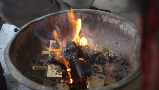 Cinematic footage of Havan or Yagya , a Hindu ritual of offering substances to a holy fire while chanting mantras.Uttarakhand India