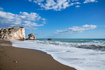 Aphrodite Beach with Stone Rocks in Aphrodite bay of Mediterranean sea water, Petra tu Romiou,...