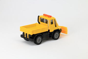 Snowplow, yellow road service truck, die cast car, toy car, white background