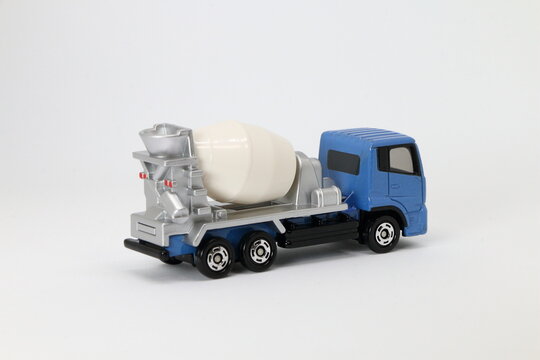 white truck on the road, die cast car, toy car, white background, cement mixer