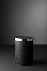 Black podium on a black background.