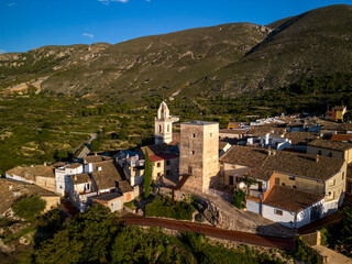 Aerial view of Almudaina village with its church and the famous medieval tower , Alicante, Costa Blanca, Spain - stock photo