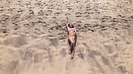 Woman Relaxing on Sandy Beach