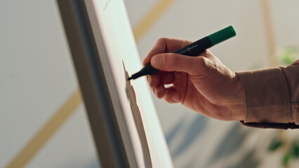 Man hand writing whiteboard at conference close up. Manager drawing presentation